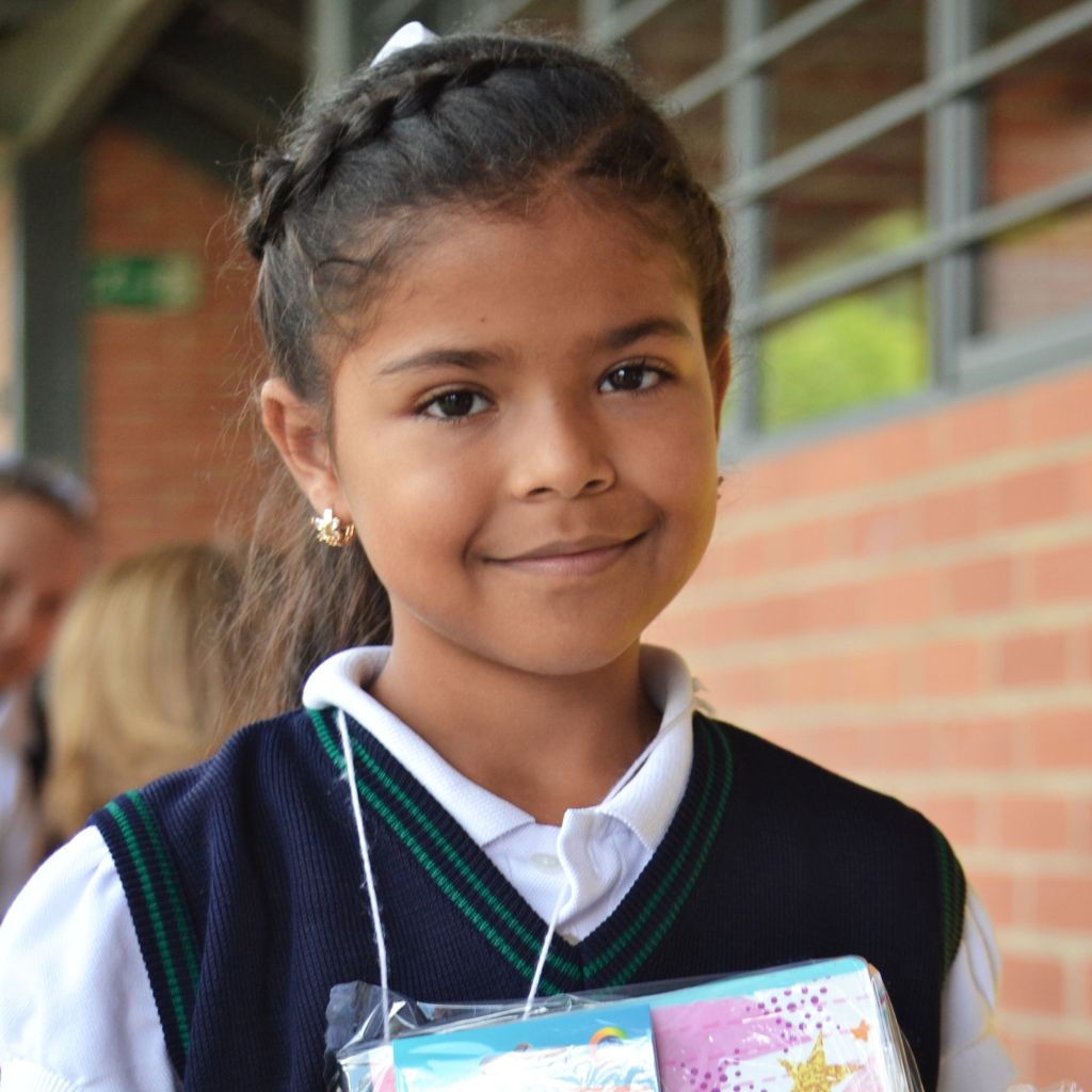 girl smiling with a book